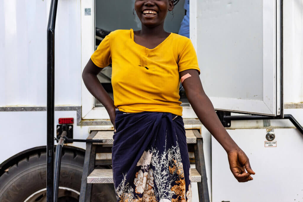 A young woman receives an injectable contraceptive device through a family planning service.