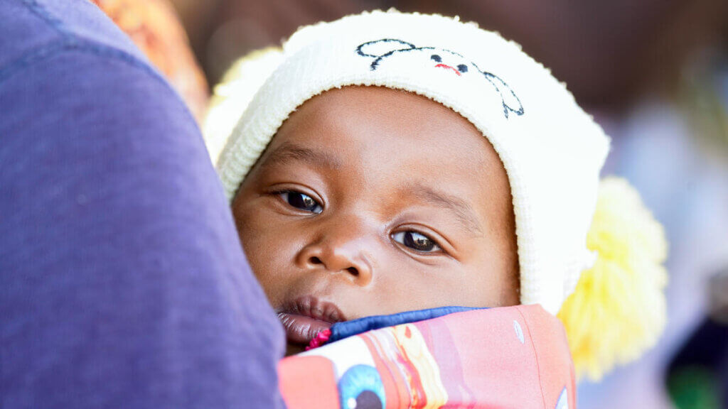 A mother and her baby wait for services at the UNFPA mobile clinic in Zambia. 