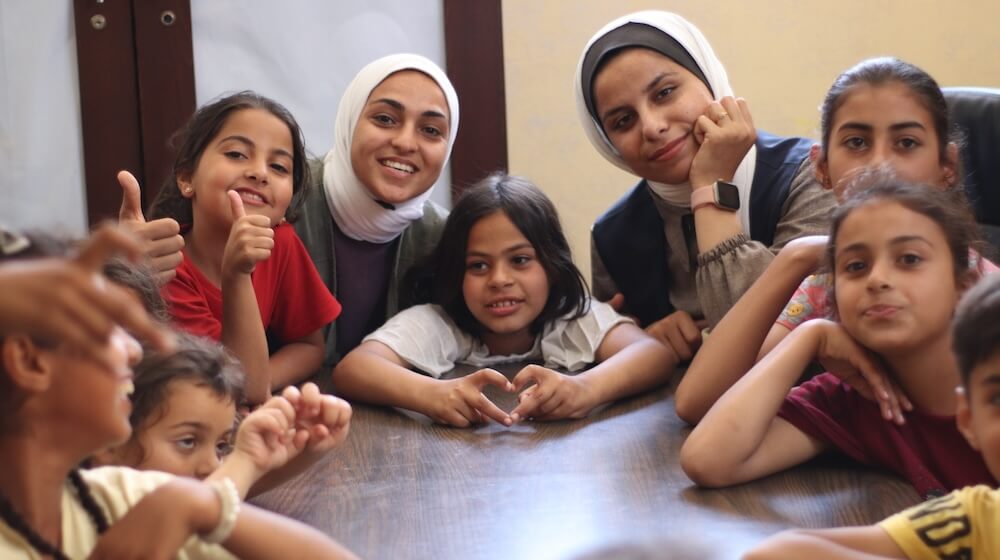 Humanitarian workers and volunteers in Gaza are working in youth-centers to give children a sense of normalcy. 