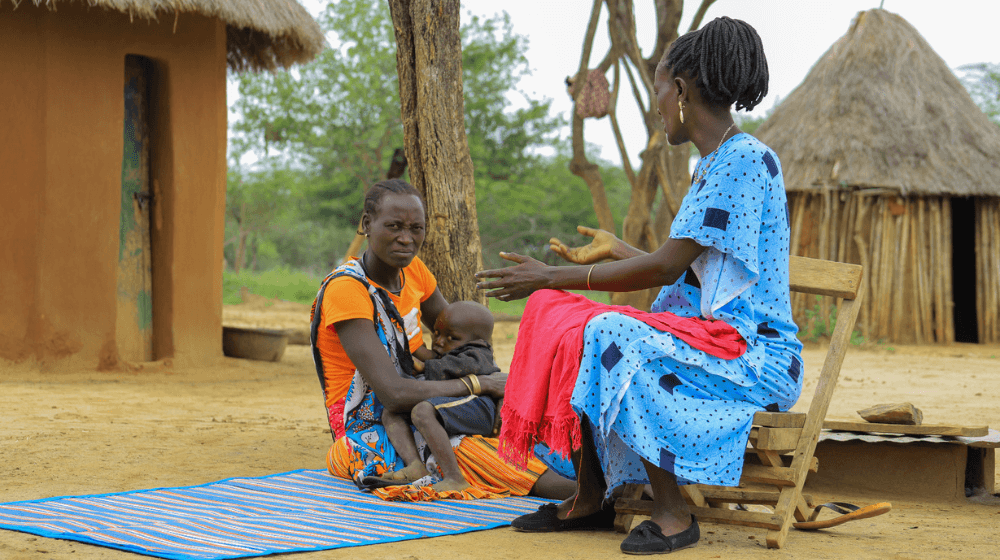 Josephine, seated, speaks to Consolata, who holds meetings for survivors of female genital mutilation and works to end the practice.